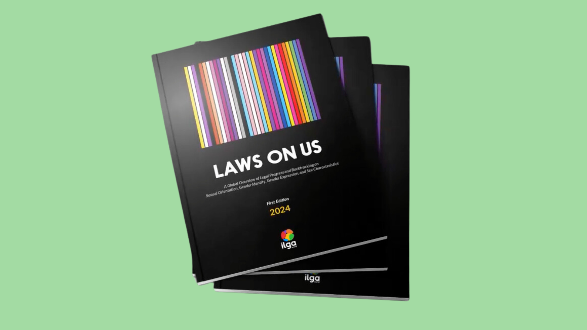 "Laws on Us": The photos shows three printed copy of the first edition of the ILGA World report