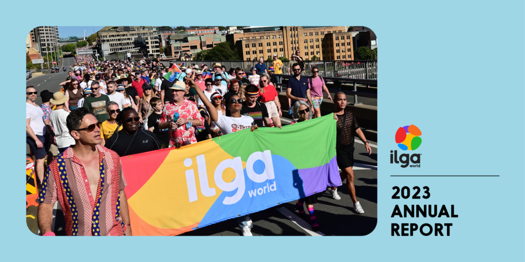 The photo shows a group of people marches behind an ILGA World banner in the colours of the Pride flag, during the Sydney WorldPride 2023. Text reads "ILGA World 2023 annual report"