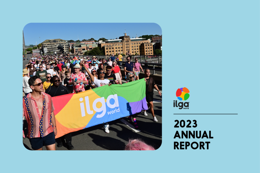The photo shows a group of people marches behind an ILGA World banner in the colours of the Pride flag, during the Sydney WorldPride 2023. Text reads "ILGA World 2023 annual report"