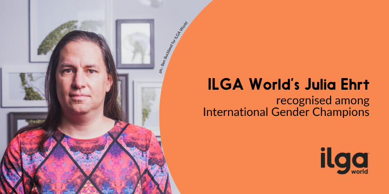 The photo of a woman, Julia Ehrt, posing for the camera. Text reads: "ILGA World's Julia Ehrt recognised among International Gender Champions". The ILGA World logo is placed at the bottom right of the image