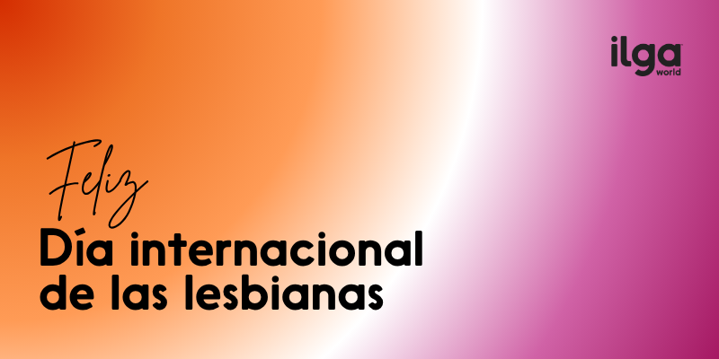 Texto que dice «Feliz Día Internacional de las Lesbianas» sobre un fondo con los colores degradados de la bandera del orgullo lésbico. El logotipo de ILGA World aparece en la parte superior derecha de la pantalla.