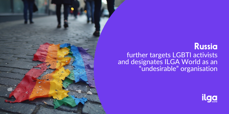 A torn, dirty rainbow pride flag lies on a city street. Text says: "Russia further targets LGBTI activists and labels ILGA World as an 'undesirable' organisation". The ILGA World logo sits at the bottom right of the image