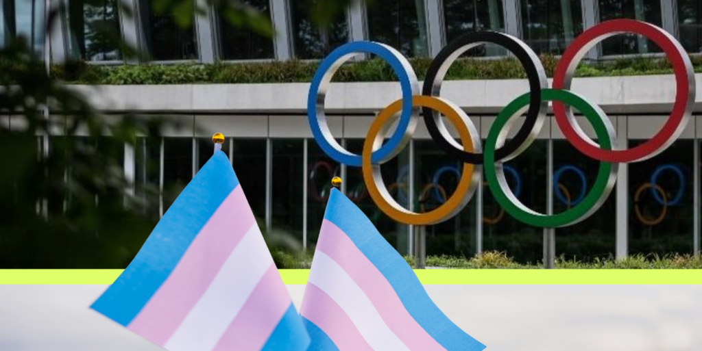 A photo of trans pride flags waving in front of the International Olympics Committee office in Lausanne, Switzerland