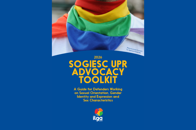 Cover of a 2026 ILGA World publication titled 'SOGIESC UPR Advocacy Toolkit: A Guide for Defenders Working on Sexual Orientation, Gender Identity and Expression and Sex Characteristics.' Close-up photo of a person wearing a rainbow-colored bandana around their neck, set against a dark blue background with yellow text, and the ILGA World logo